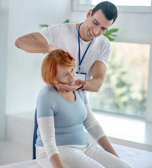 A man massaging a woman's neck