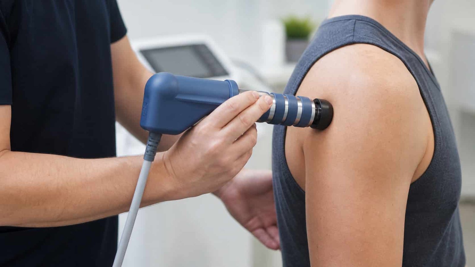 Radial shockwave therapy applied to the lateral shoulder for rotator cuff pain at Brooklyn Chiropractic Care in Greenpoint